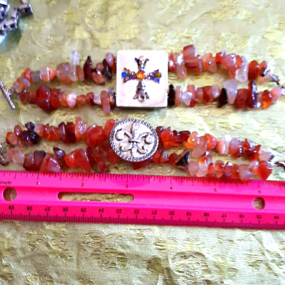 Double strand bracelets ..cross and flora de lez..both bracelets